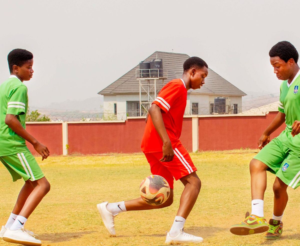 Pupils playing football
