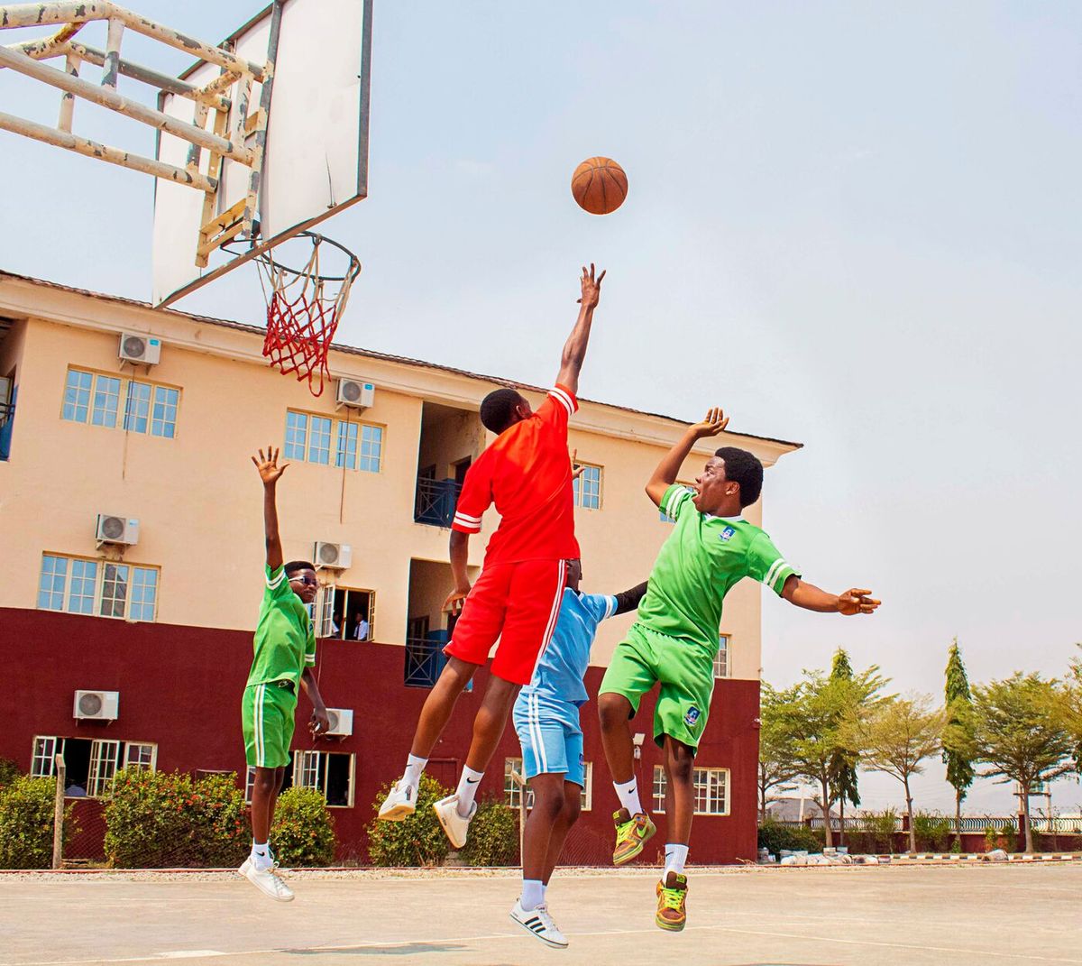 Pupils playing basketball